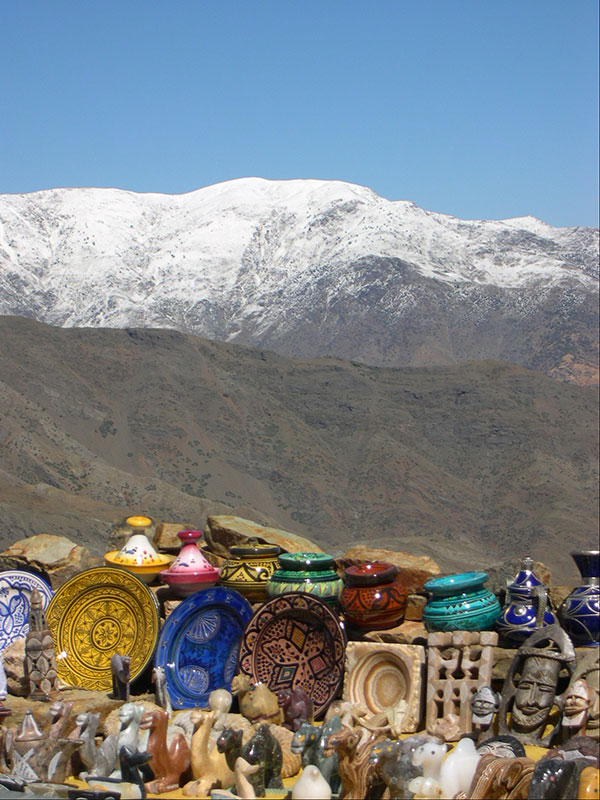 Moroccan pottery with Alts mountains in background