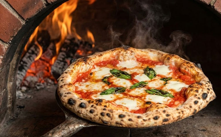 A classic Neapolitan Margherita pizza with a puffy, charred crust coming out of a wood-fired oven