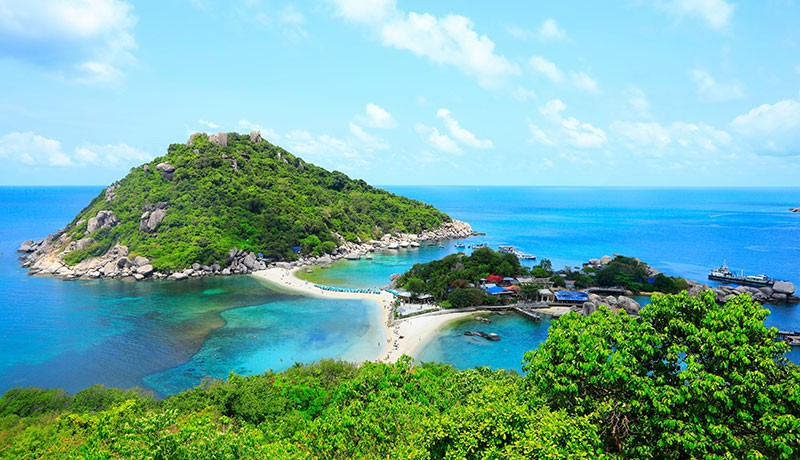 igh-angle view of Koh Nang Yuan showing the unique white sandbar connecting three small islands surrounded by blue water.