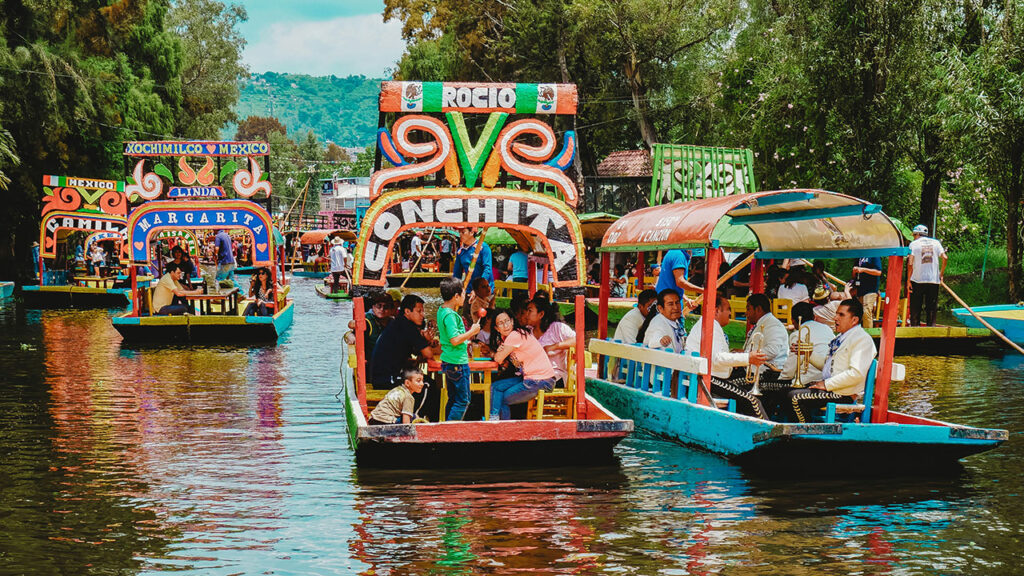 Colorful trajineras tour boats floating on the canals of Xochimilco in Mexico City