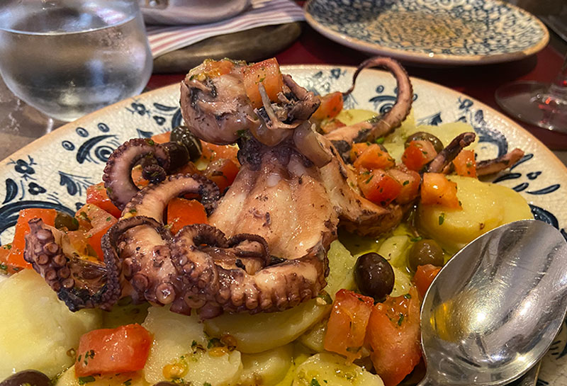 Polpo con Patate: A classic warm octopus and potato salad served in the Cinque Terre.