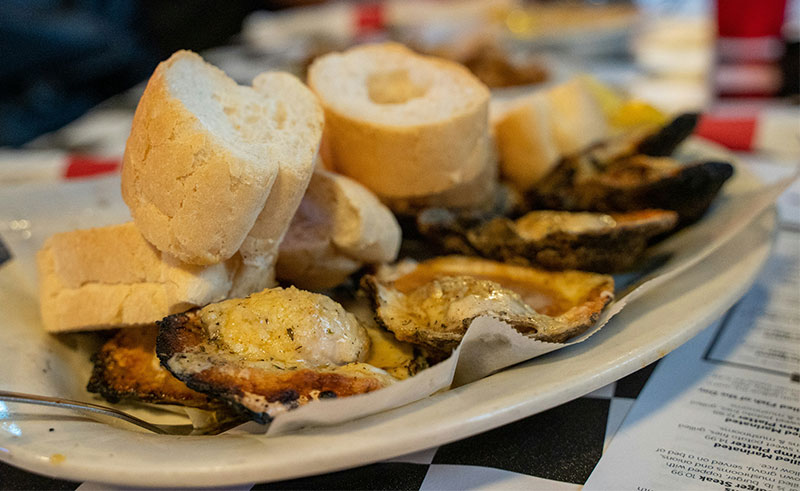 Plate of grilled oysters from Acme Oyster House