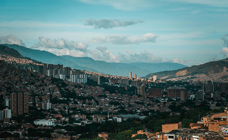 Medellín spreads across a lush valley, surrounded by steep green mountains in every direction