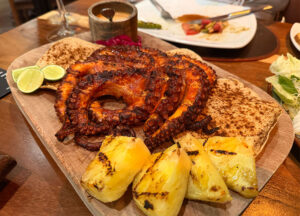 Whole grilled octopus al pastor with pineapple at Asador La Vaca Argentina Mazatlán