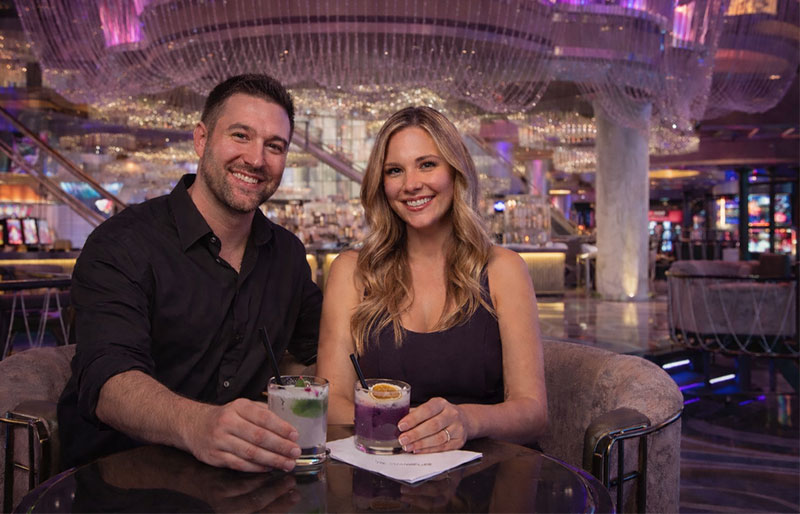 Couple enjoying cocktails at The Chandelier Bar inside The Cosmopolitan in Las Vegas