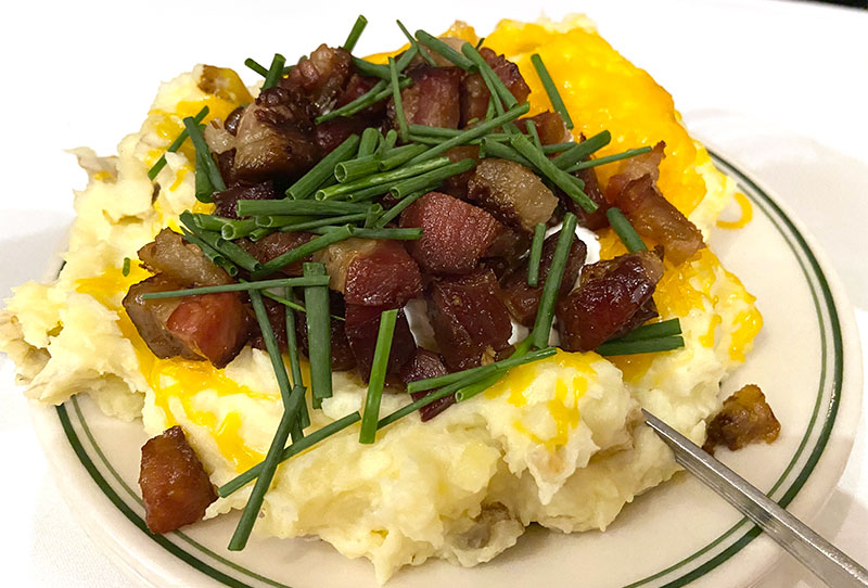 Oversized loaded mashed potatoes with bacon and chives
