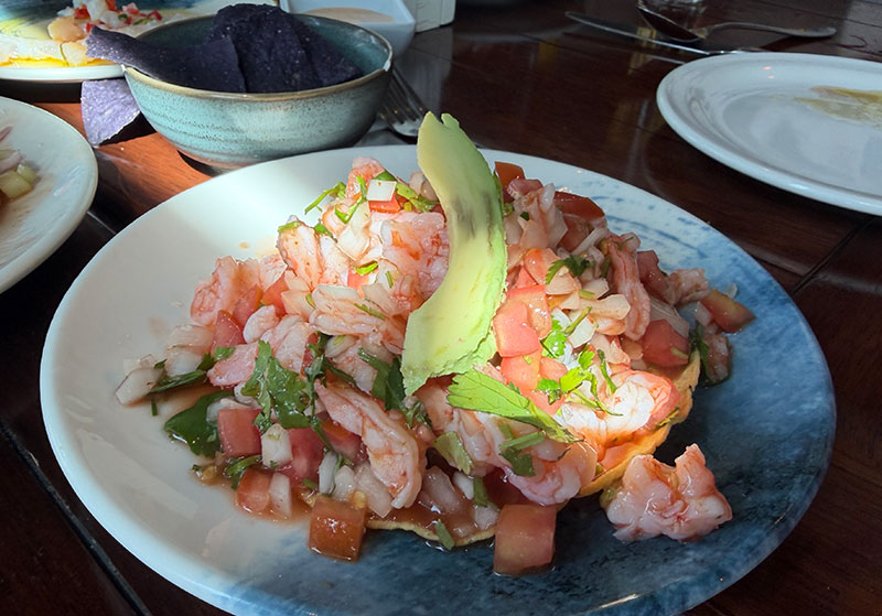 Shrimp ceviche tostada with tomato, cilantro, onion and avocado at Los Arcos restaurant in Mazatlán