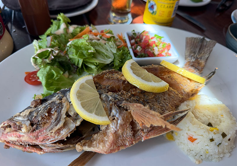 Whole fried red snapper with lemon served at Los Arcos seafood restaurant in Mazatlán Mexico