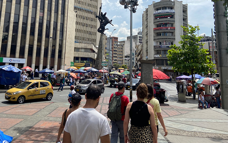Busy street scene in downtown Medellin Colombia with pedestrians and vendors