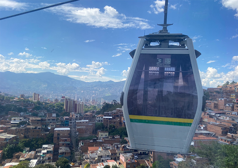 Medellin metrocable gondola ride over hillside neighborhoods and city