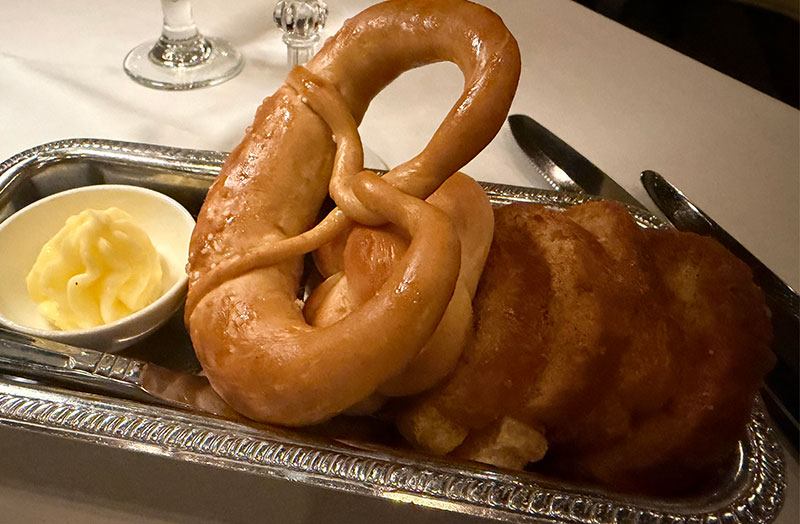 bread basket with pretzel roll and butter served at Murray’s steakhouse Minneapolis