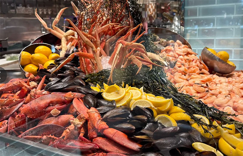large, fresh pile of chilled seafood, including crab legs and shrimp, served on ice at the Bacchanal Buffet in Caesars Palace.