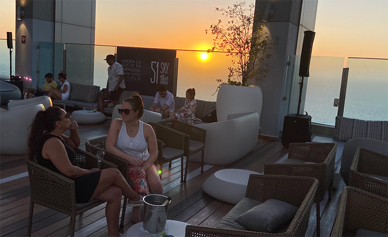 Sunset view from the 51 Sky rooftop bar in Bocagrande, Cartagena with lounge seating and ocean horizon.