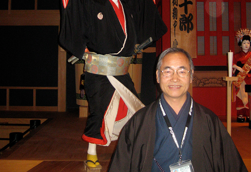 Museum guide in traditional clothing at a Tokyo cultural exhibit