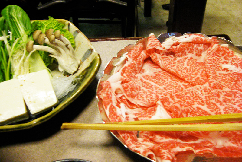 Thinly sliced wagyu beef prepared for hot pot dining in Tokyo