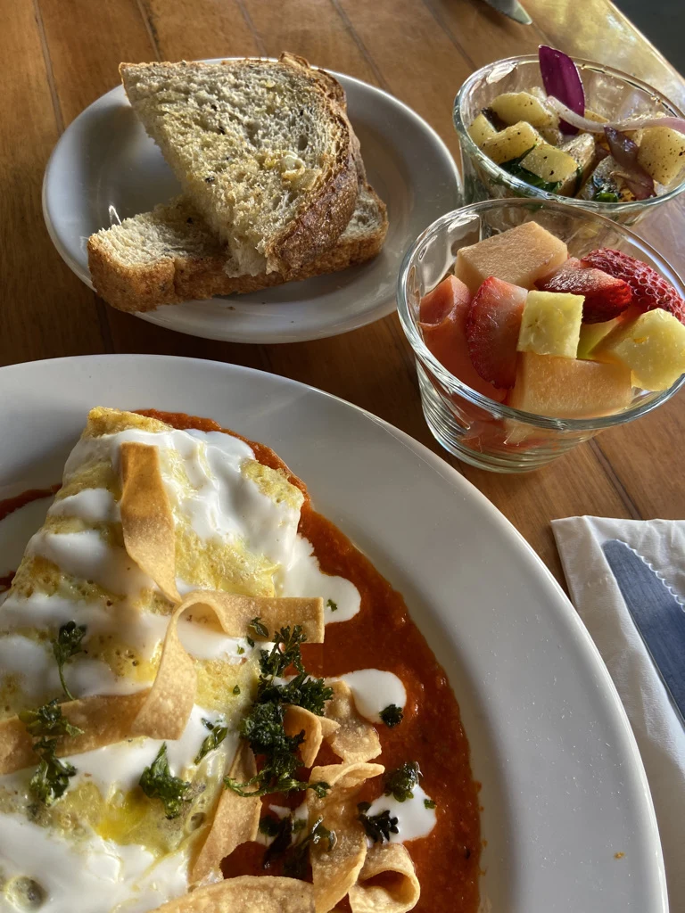 Breakfast plates with an omelet, fruit and bread at Rico’s Café in Mazatlán.