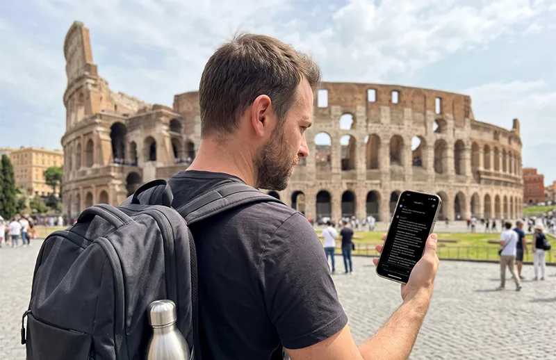 A 30-something male traveler with a backpack and water bottle looking at the ChatGPT app on his phone, with the historic Colosseum in Rome in the background.